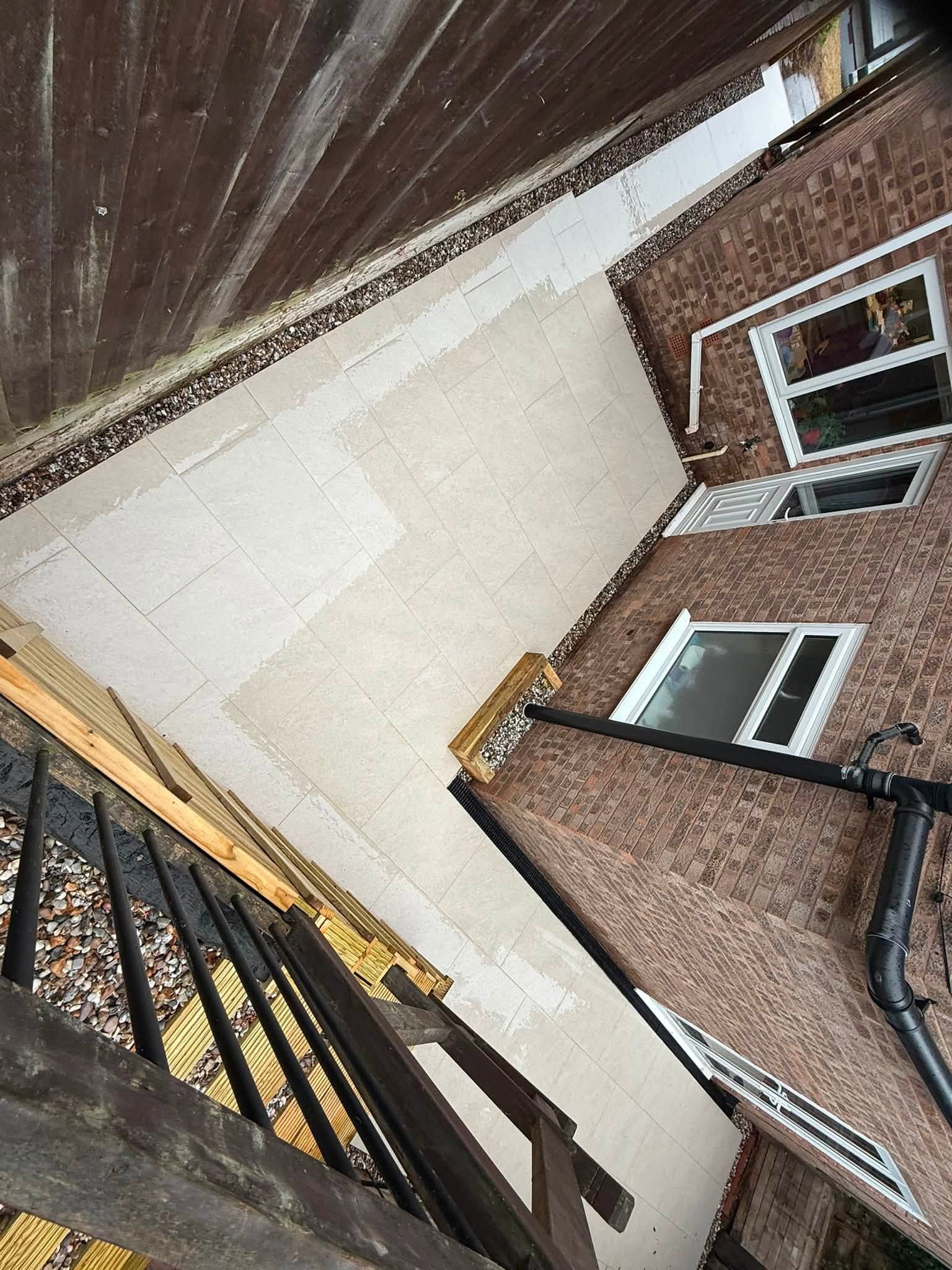 Pale paving down a side return, seen from above